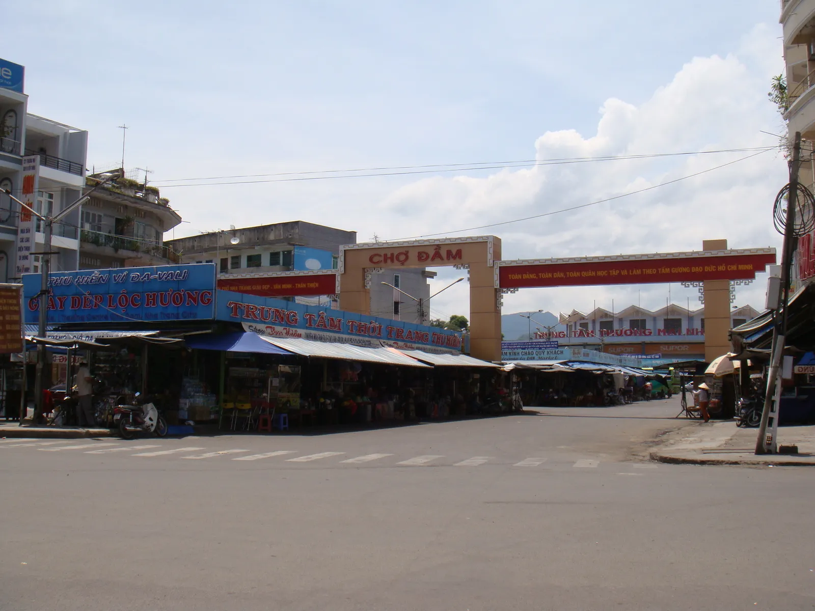 Cho Dam market entrance gate and shop awnings on a Nha Trang street