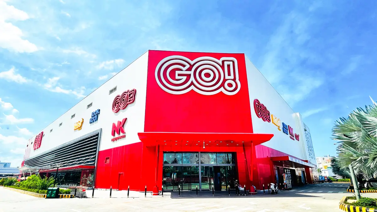 Red and white hypermarket building with a large GO! logo on the facade