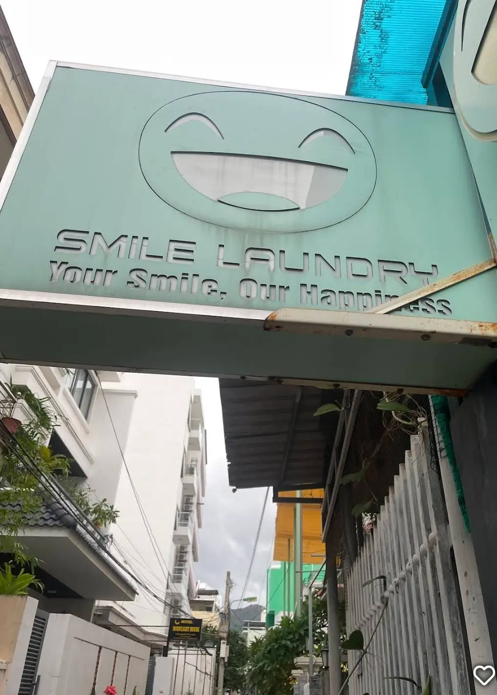 Smile Laundry sign above a narrow shopfront