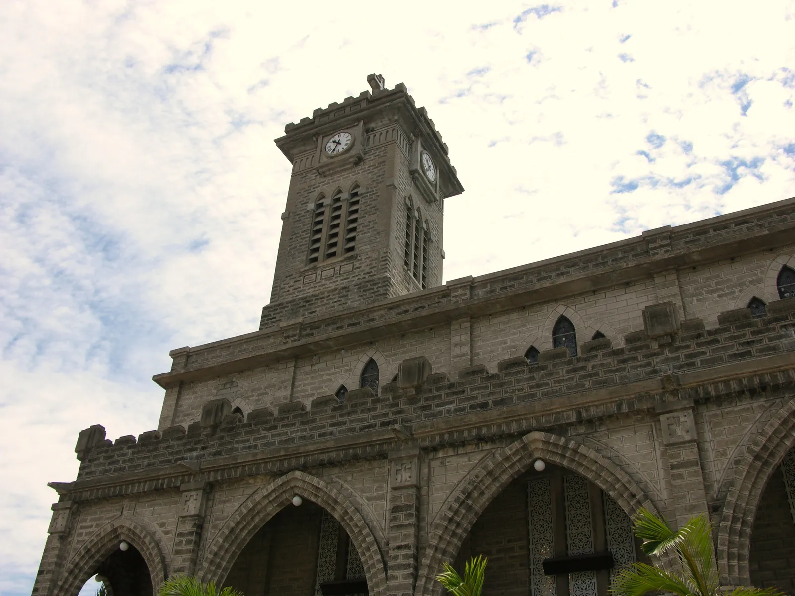 Stone Gothic-style cathedral with a bell tower on a hill in Nha Trang