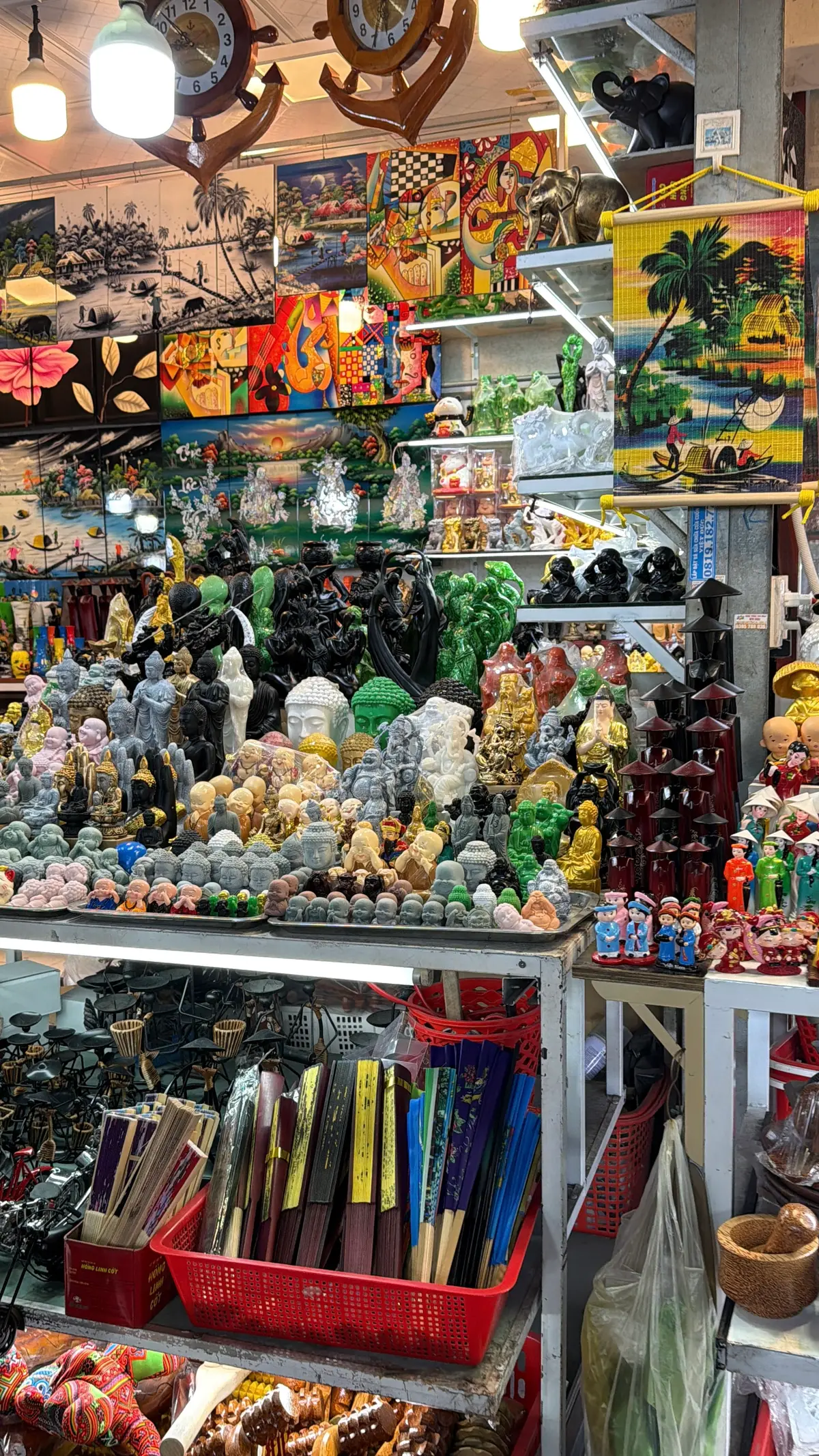 Shelves of small stone ornaments in many colours