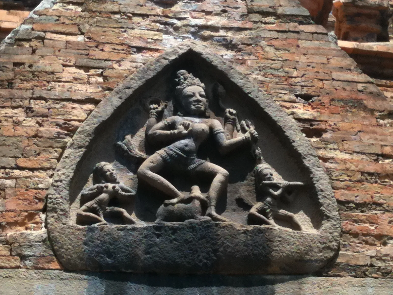 Carved stone relief of a goddess on a buffalo above the east face doorway of a Po Nagar tower