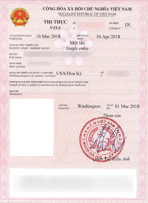Specimen of a pink loose-leaf Vietnam visa with the holder details, the validity dates and a red round seal